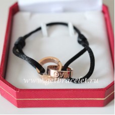 Bracciale Love con doppio anello Cartier in oro rosa e corda nera
