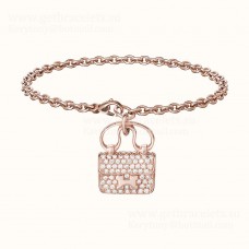 Bracciale Hermes Constance Amulette in oro rosa con gioielli di diamanti Bracciale Hermes Constance Amulette in oro rosa con gioielli di diamanti