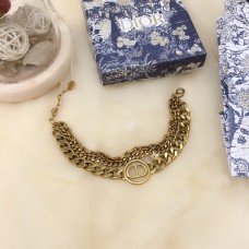 Christian Dior30 Montaigne Bracciale multicatena finto con logo CD in ottone antico e ciondolo circolare